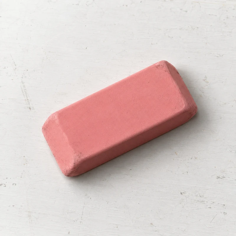 Rubber eraser on a lightly marked white studio table
