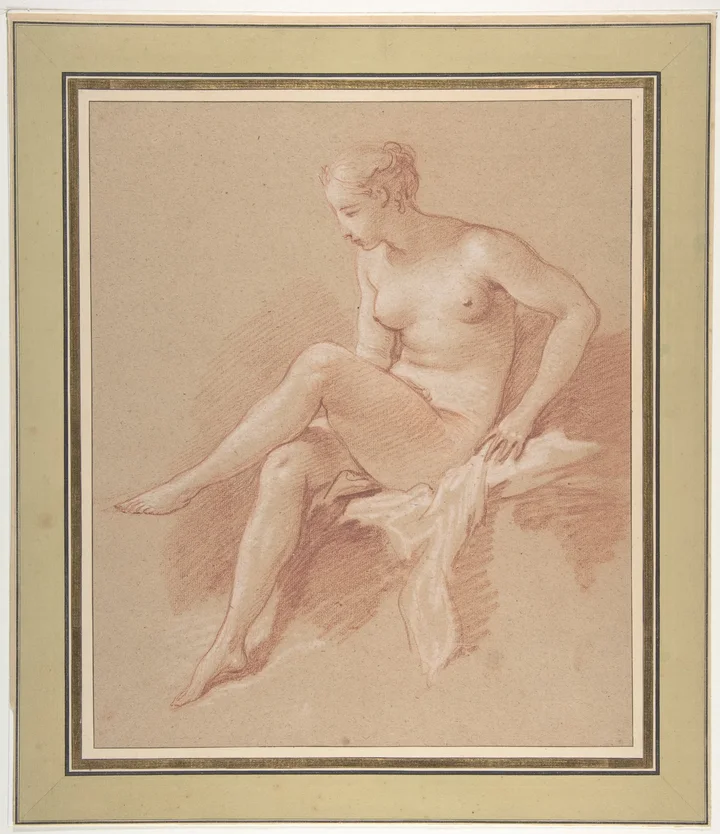 A seated female figure in red chalk with one leg raised.